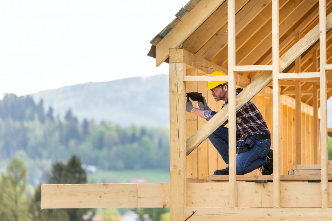 roofer-builder-working-on-roof-structure-at-construction-site.jpg